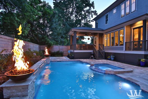 fire and water pool design with waterfall and hot tub