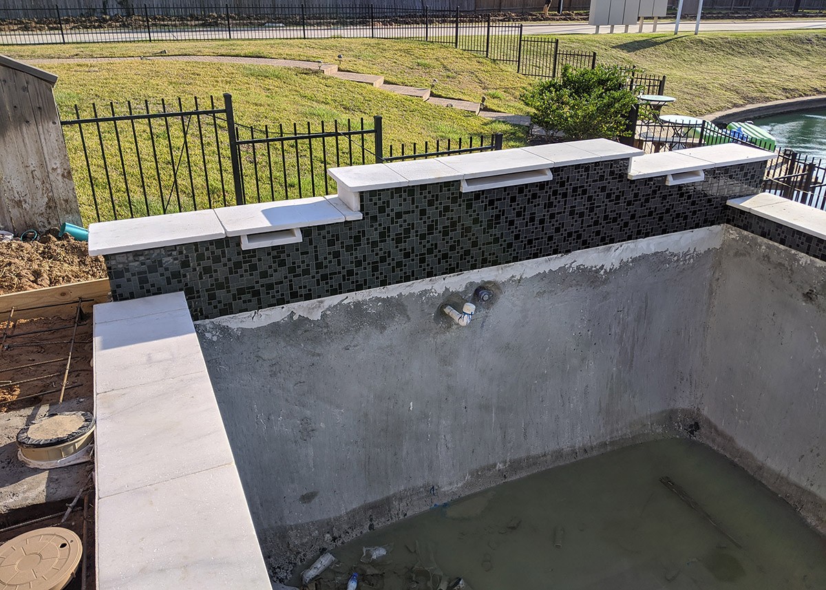 Tile and Coping the inside of a swimming pool